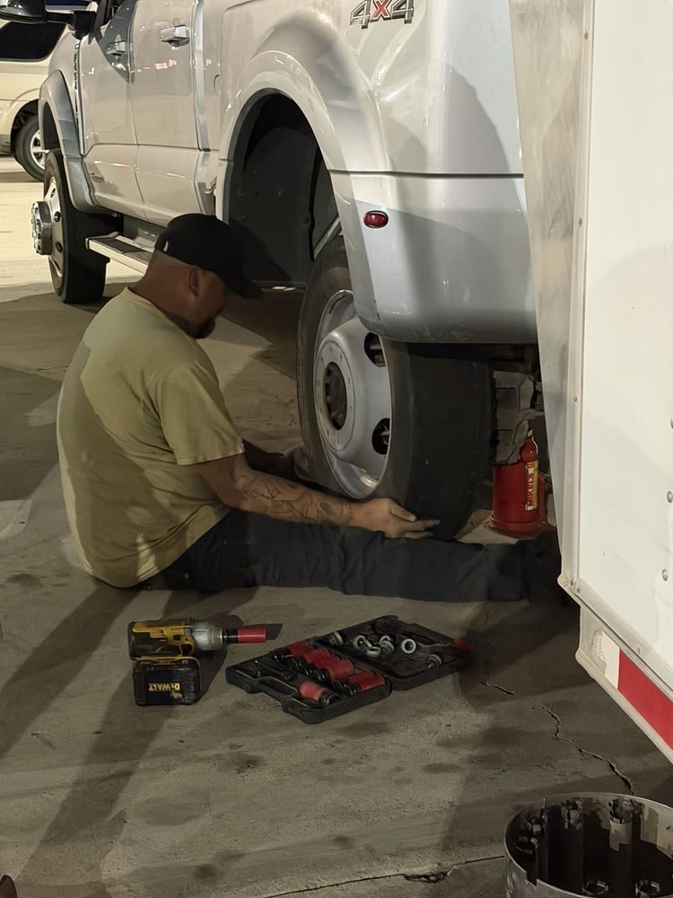 Technician servicing a truck